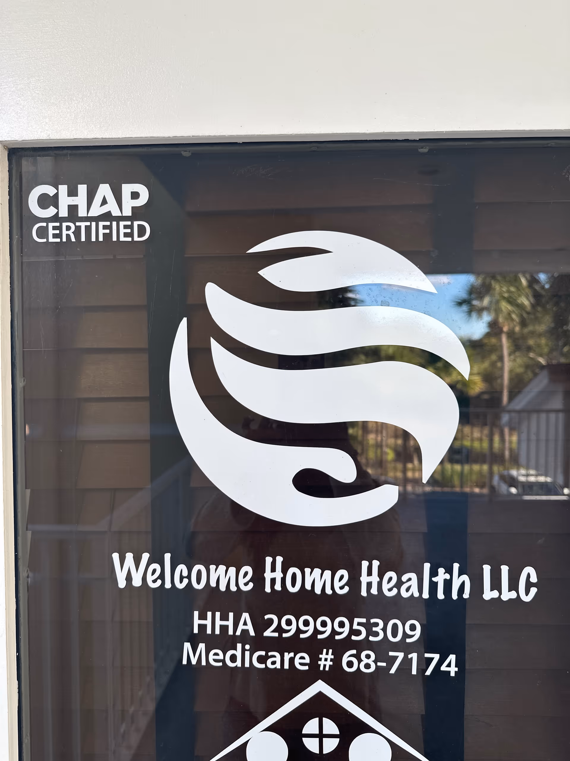 Glass window sign reads Welcome Home Health LLC and CHAP Certified logo.