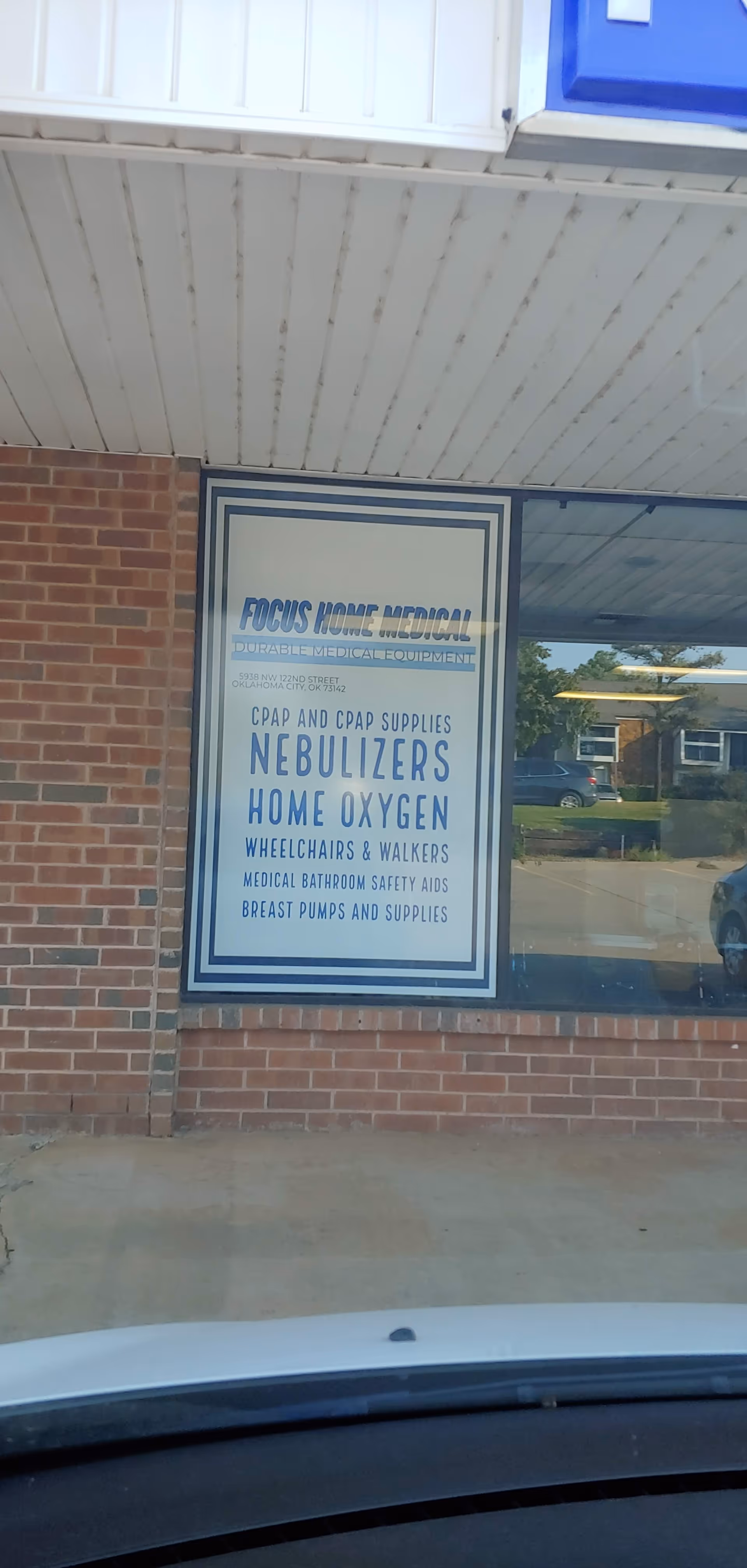 Brick storefront with Focus Home Medical sign listing nebulizers, oxygen, wheelchairs, and medical supplies.