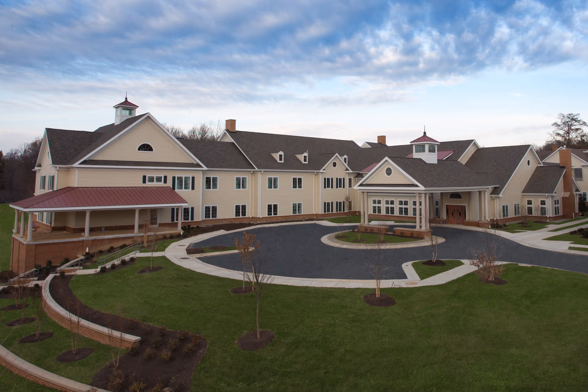 A large Brooke Grove Retirement Village building with a circular driveway and manicured lawns.