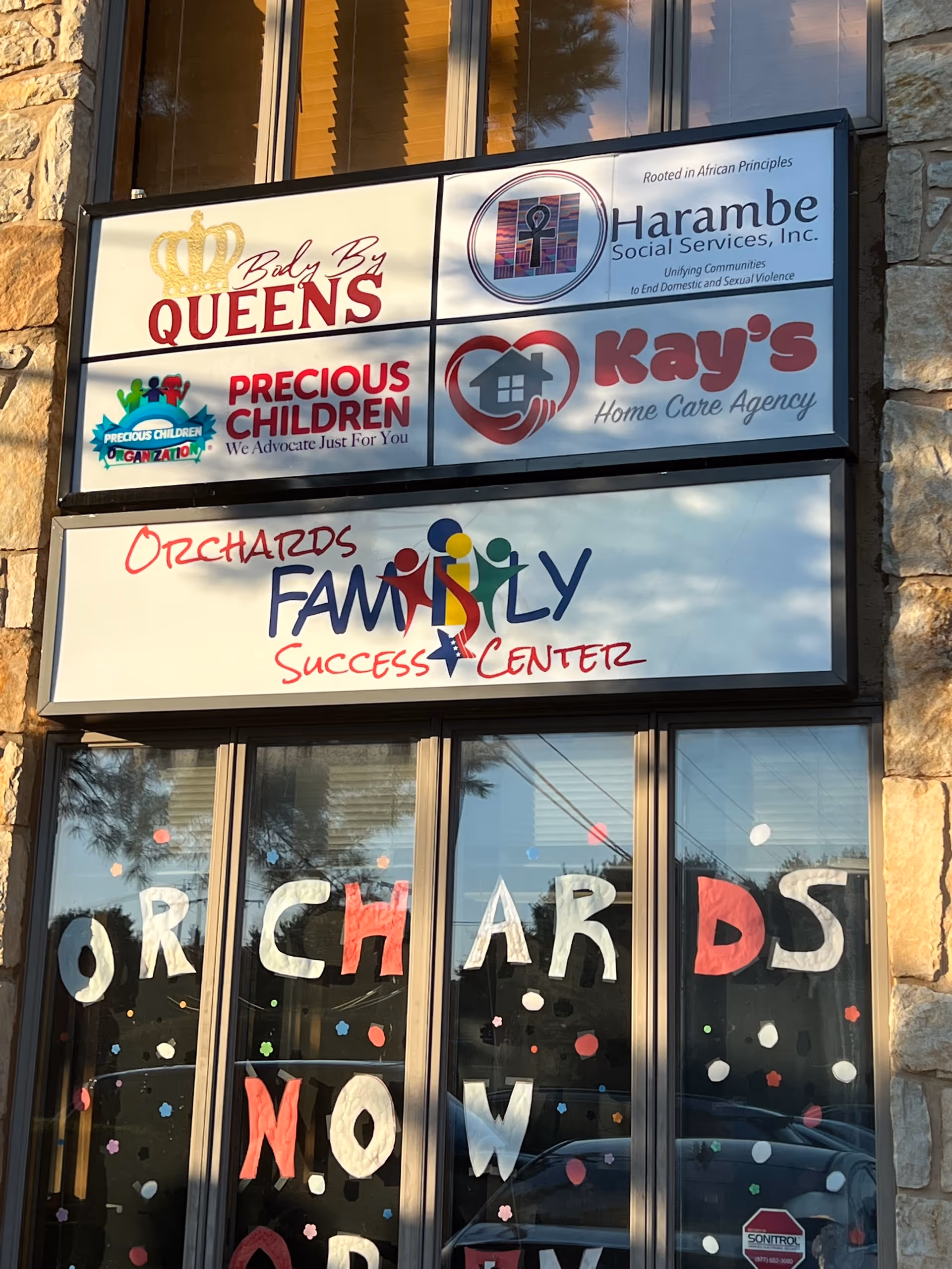 Exterior building front with signs for Kay's Home Care Agency and Orchards Family Center.