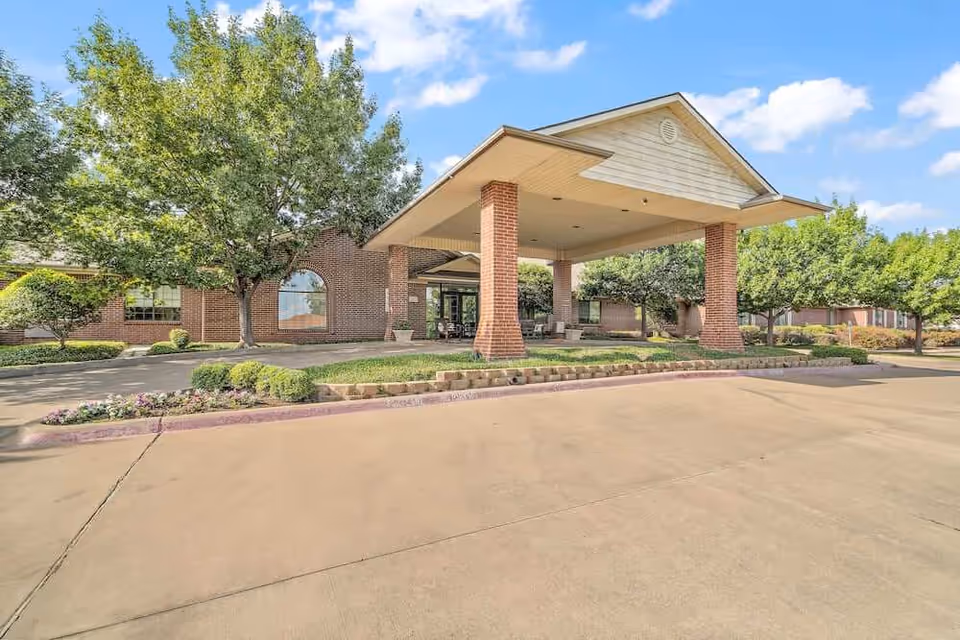 Exterior view of Morada North Richland Hills, showing the brick entrance and porte-cochere.