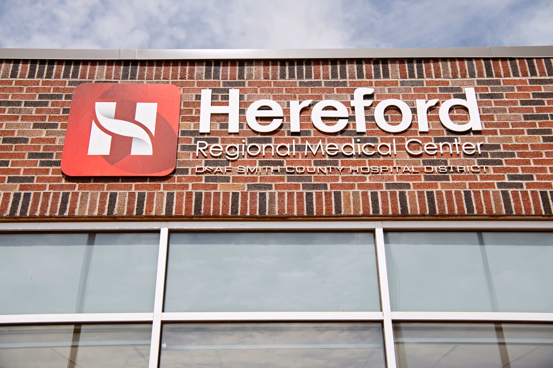 Front view of Hereford Regional Medical Center sign on a brick facade.