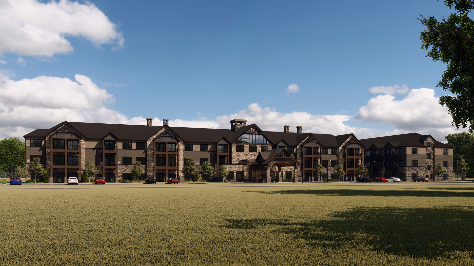 A large brick and stone senior living facility exterior with a green lawn.