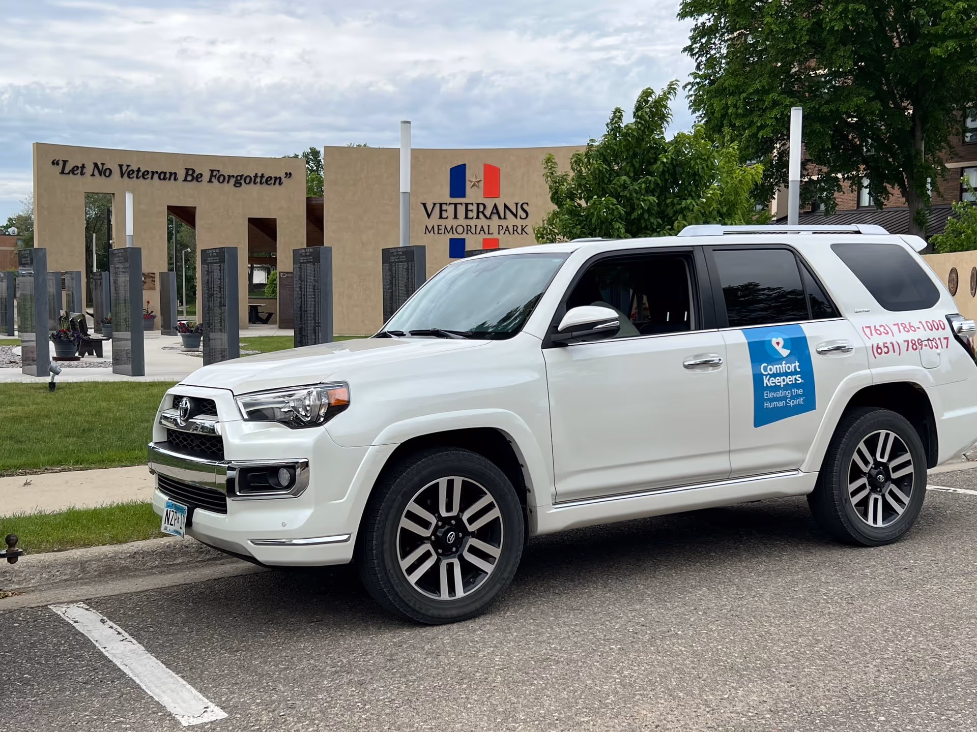 White Comfort Keepers SUV parked near Veterans Memorial Park.