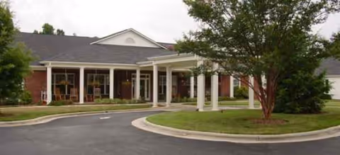 Front exterior view of a Brookdale senior living facility with driveway and entrance.
