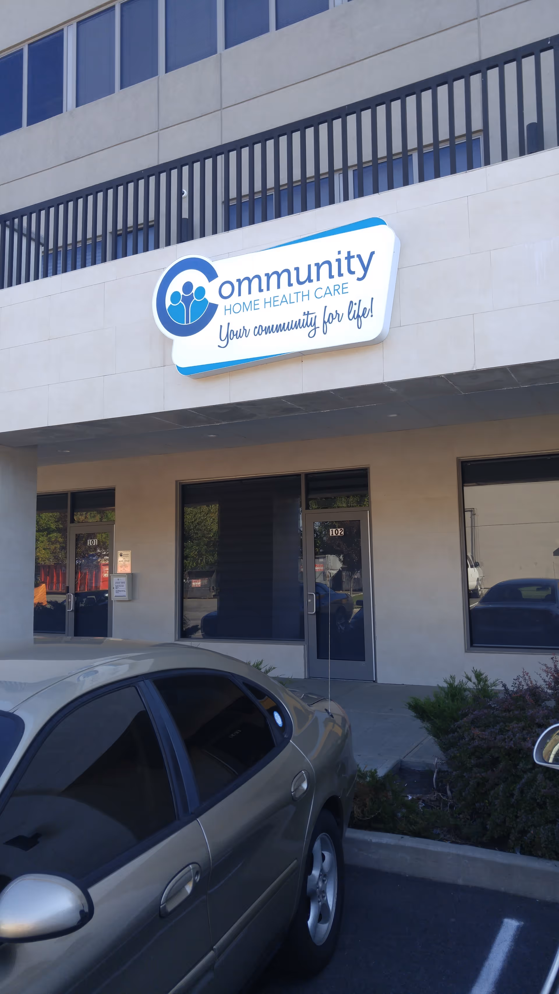 Front exterior of a building with a Community Home Health Care sign.