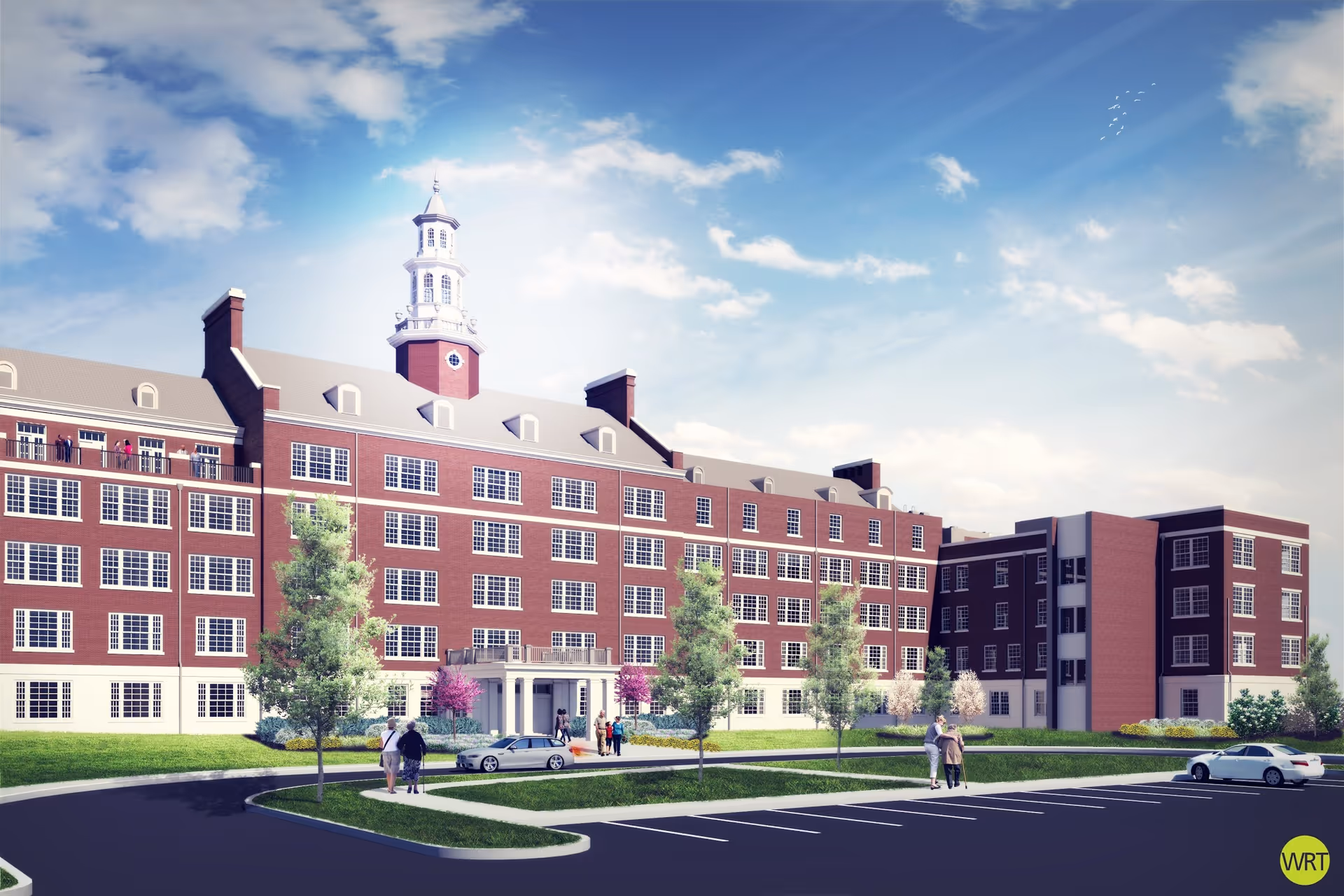 A large brick senior living building with a central entrance and surrounding parking.