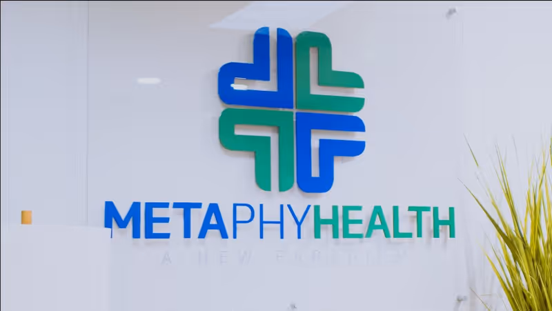 Building front of MetaPhy Health with blue-green logo