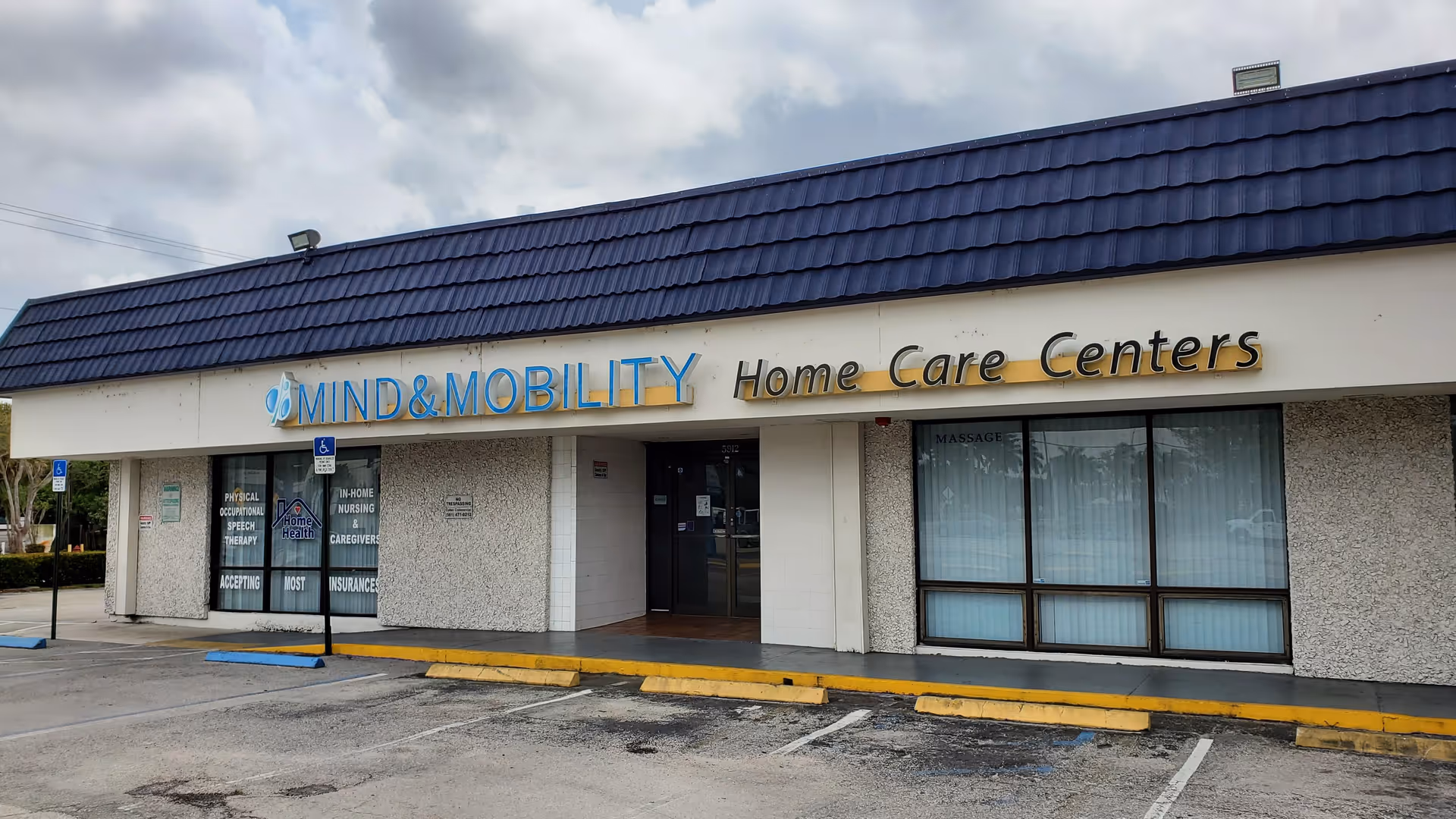 Exterior view of Mind and Mobility Home Care Centers storefront with parking and entrance.