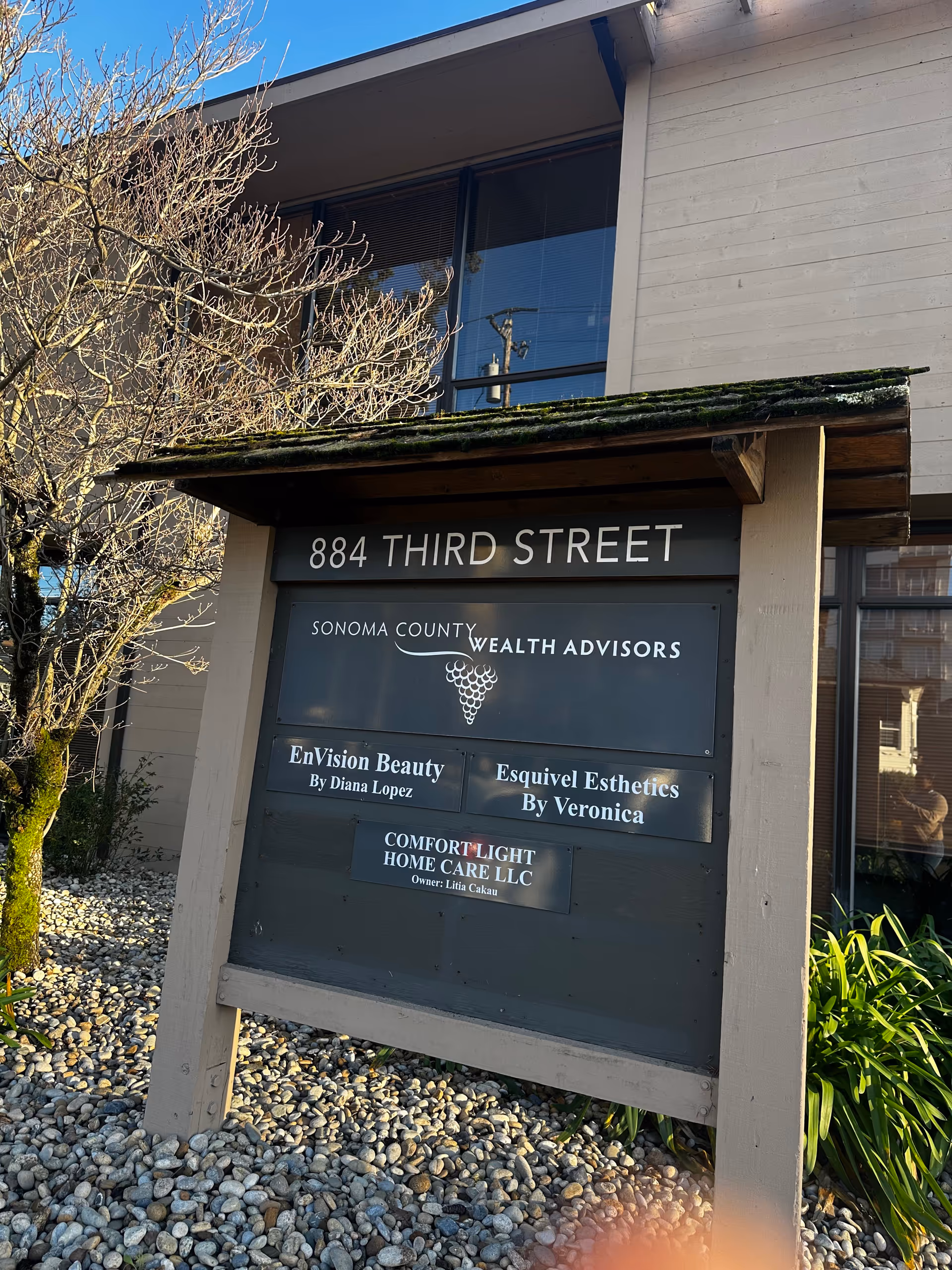 Exterior building signboard shows address 884 Third Street and several business names.