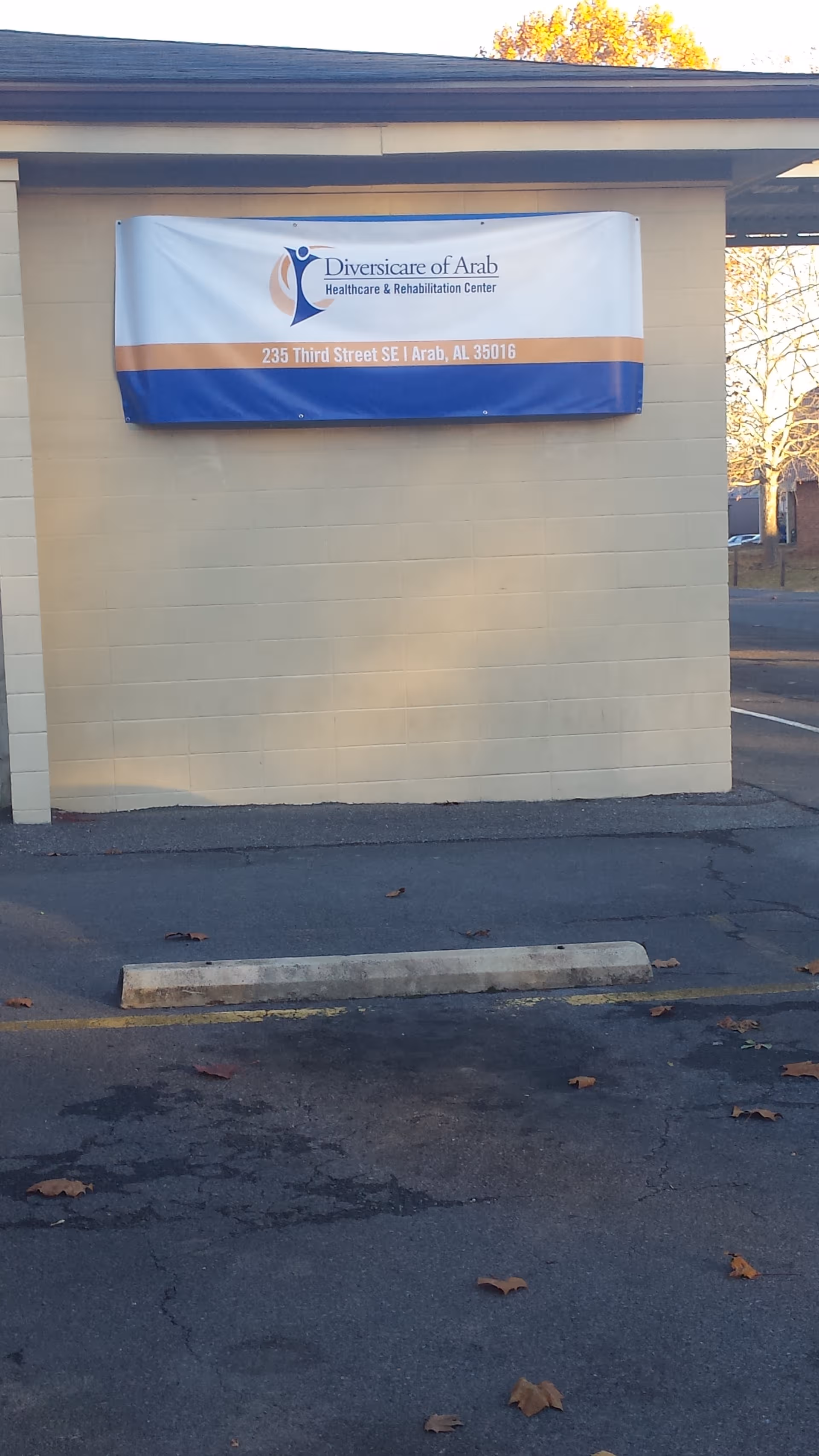 Exterior wall with a banner for Diversicare of Arab healthcare and rehabilitation center