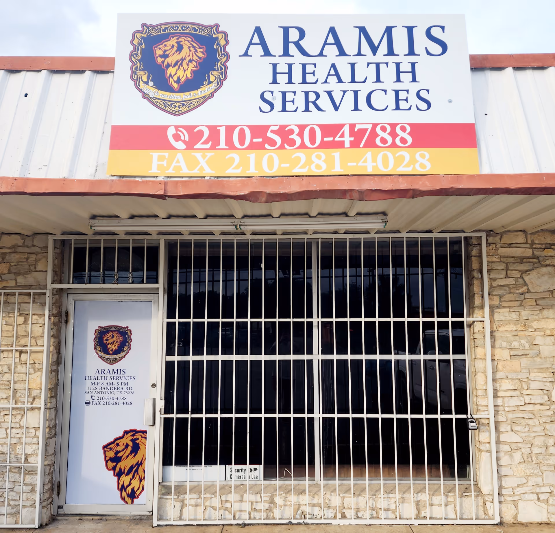 Front view of Aramis Health Services building with a large sign and bars.