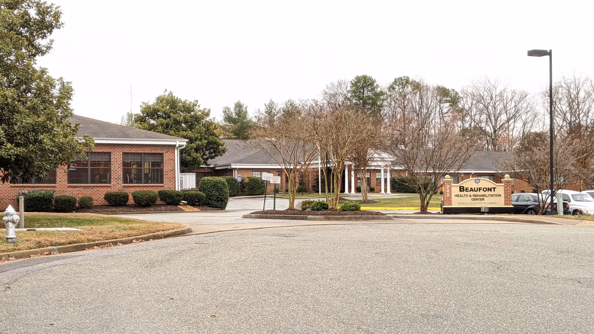 Exterior view of Beaufont Health & Rehabilitation Center with front entrance and sign