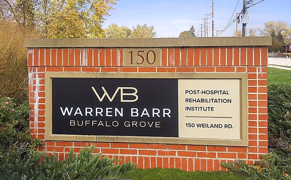 Brick sign for Warren Barr Buffalo Grove with 150 Weiland Rd.