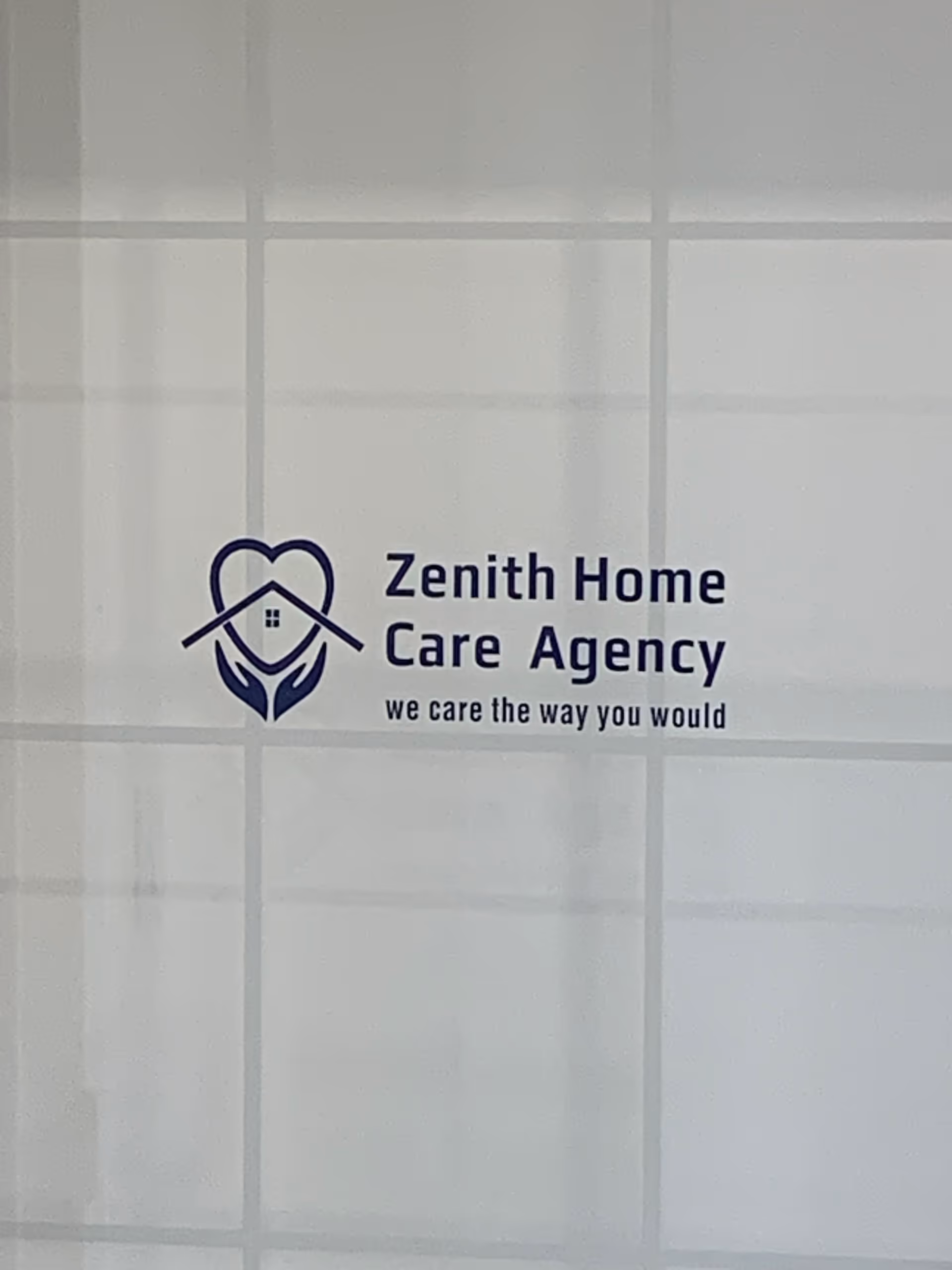 Interior wall with Zenith Home Care Agency logo and tagline visible.