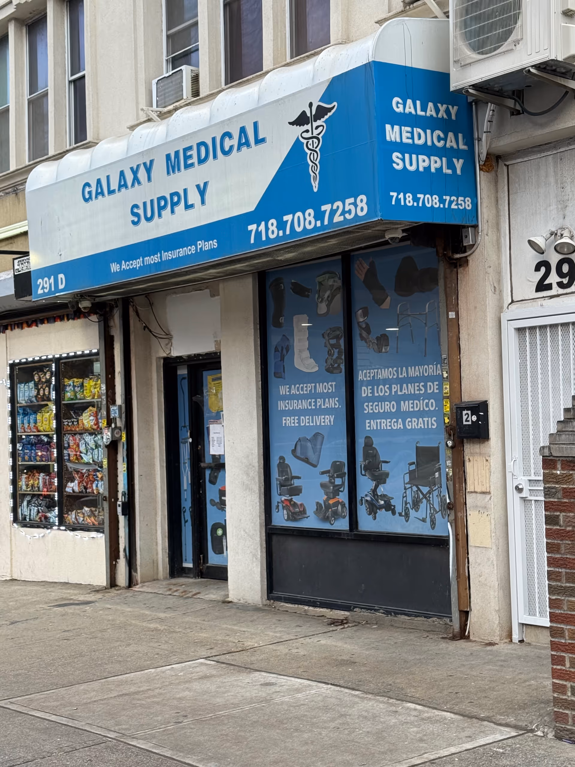 Blue Galaxy Medical Supply storefront sign dominates the building front on a city sidewalk.