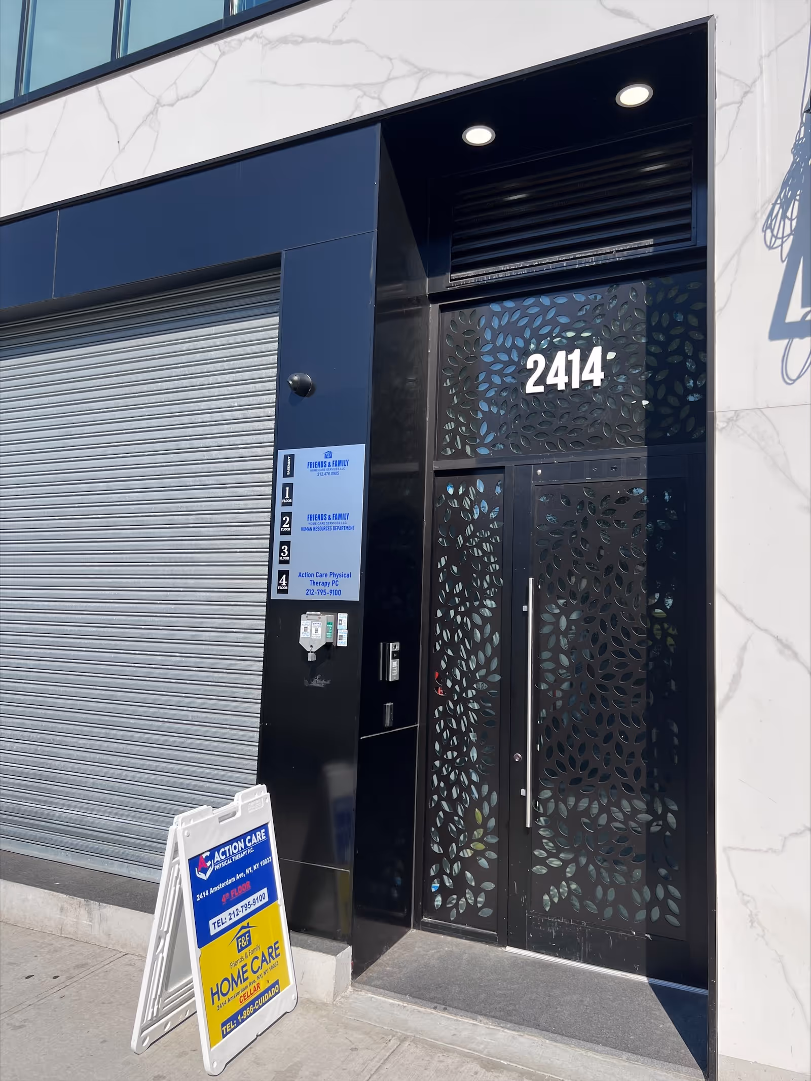 Modern building entrance with decorative black doors and signage for Friends and Family Home Care.