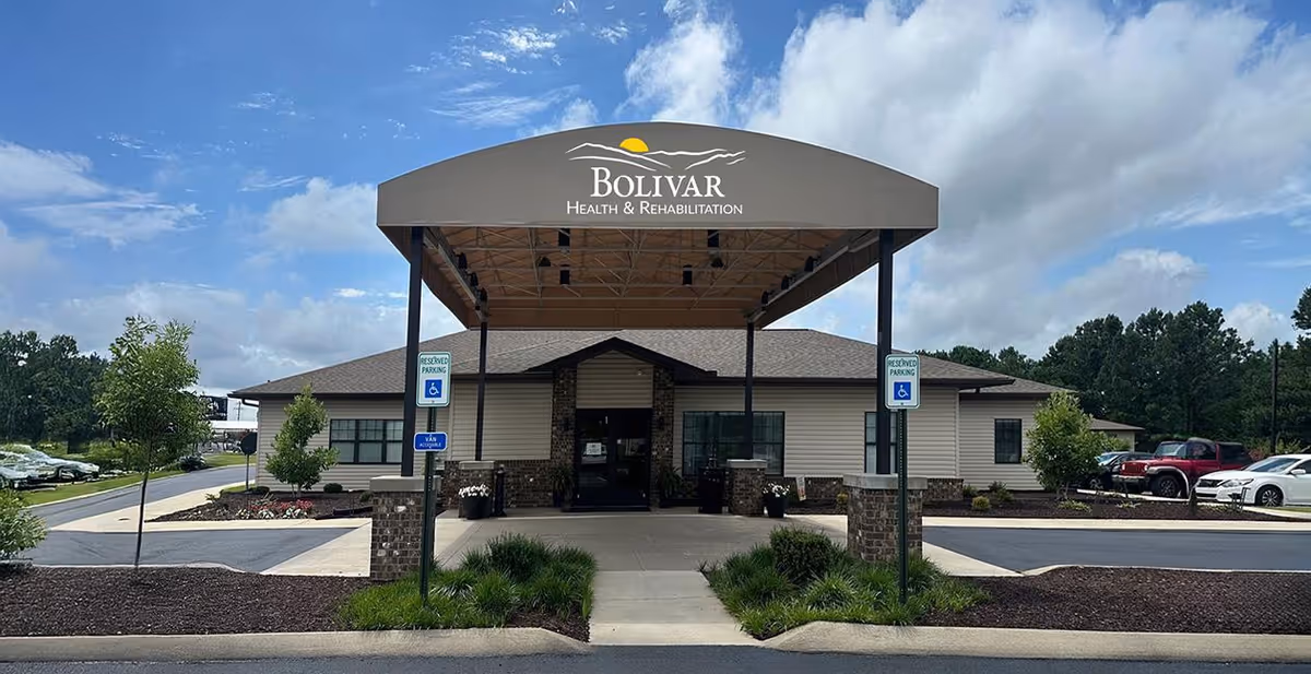 Exterior view of Bolivar Health & Rehabilitation entrance with canopy and parking.