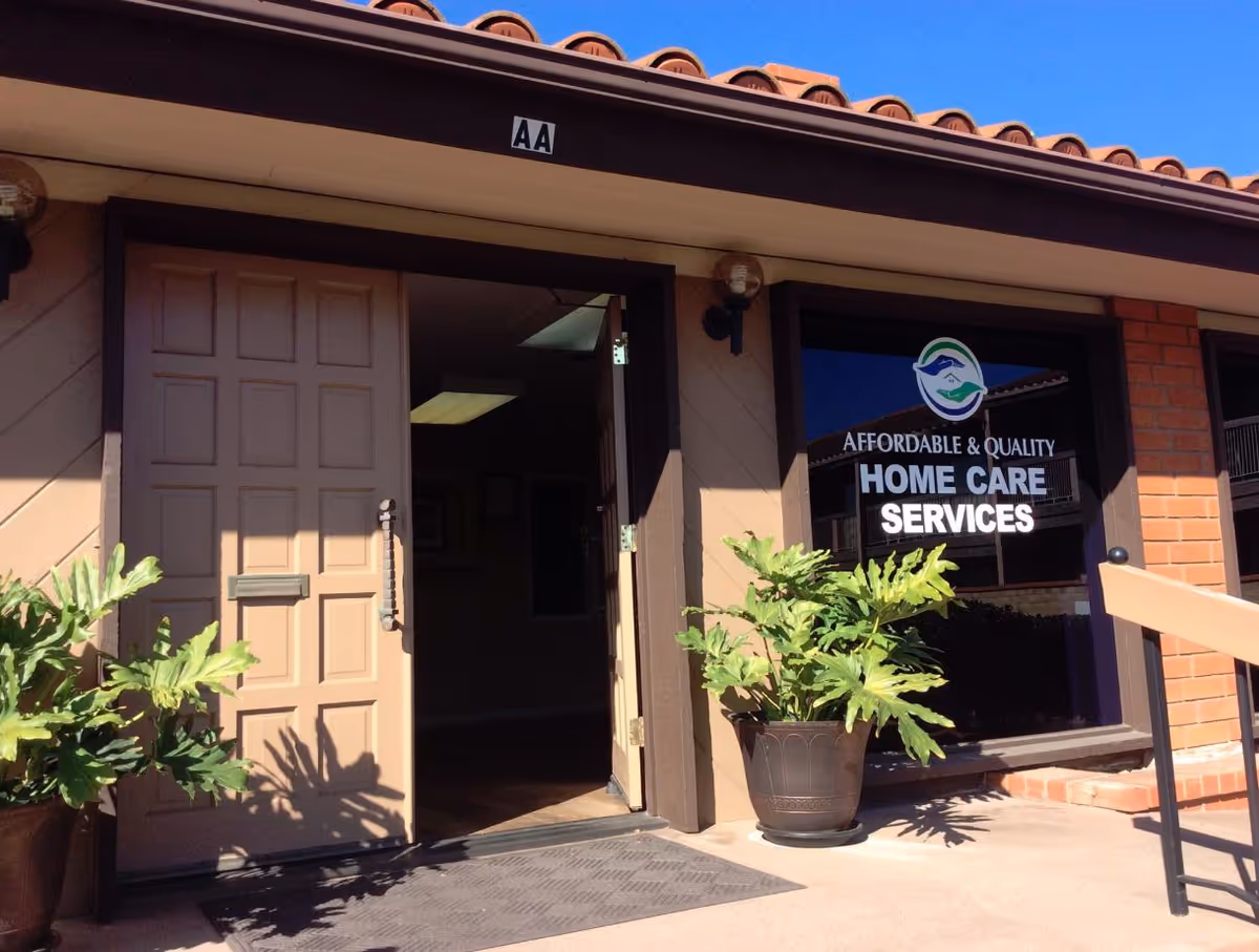 Entrance of Affordable & Quality Home Care Services building with potted plants