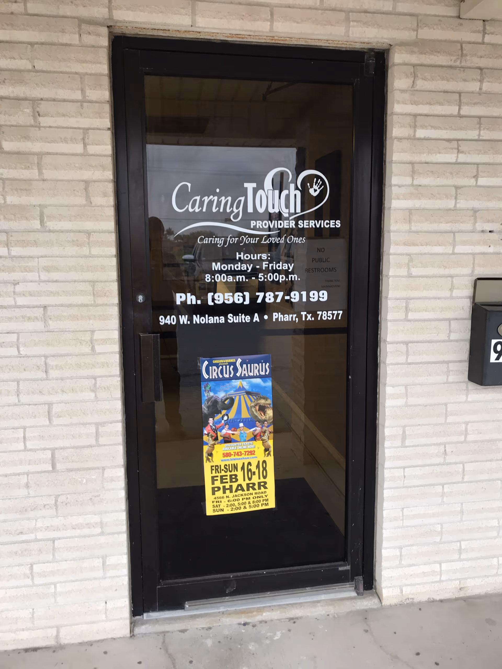 Front entrance door for Caring Touch Provider Services with a colorful poster.