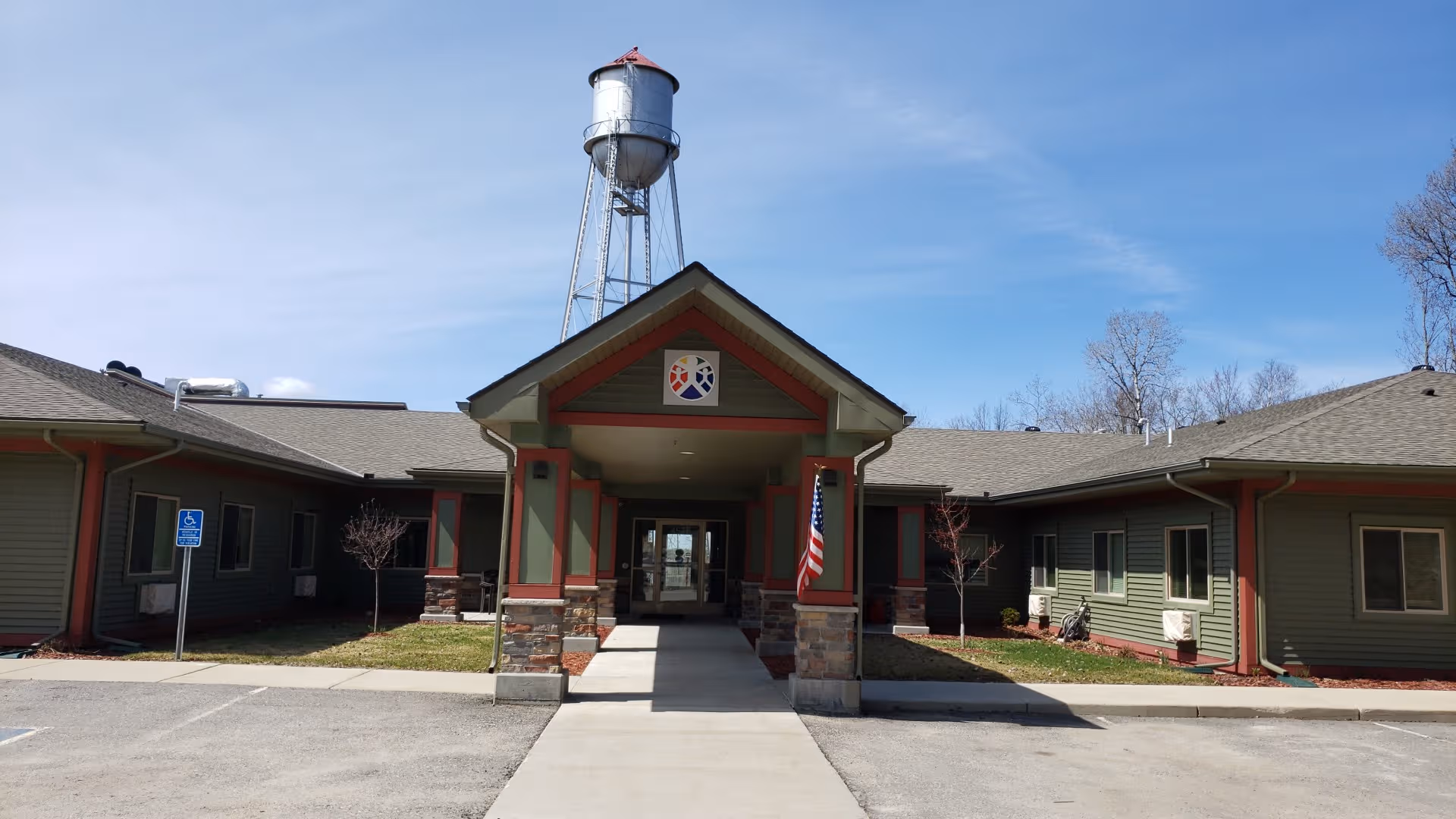 The front entrance of Carefree Living Orr is a single-story facility with a covered walkway.