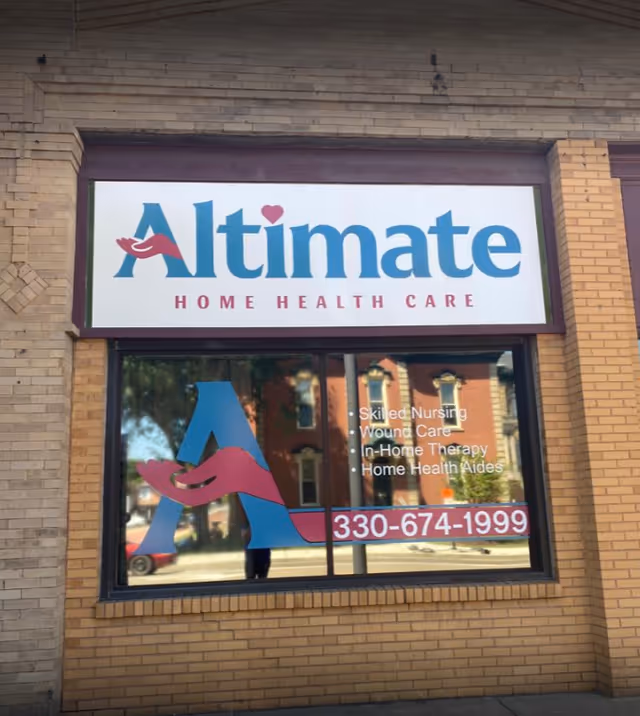 Exterior view of Altimate Home Health Care storefront with sign and window graphics