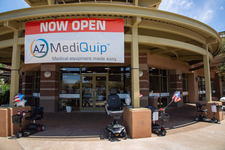 Exterior view of AZ MediQuip Goodyear storefront with mobility scooters outside.