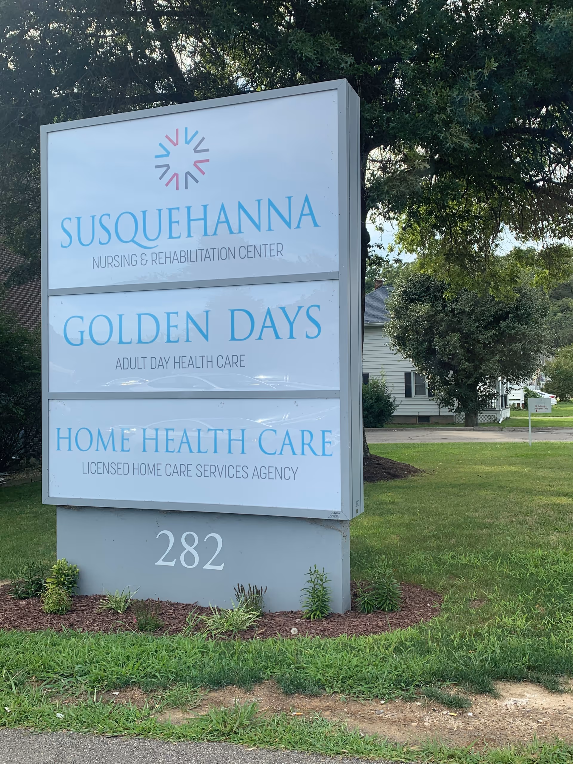 Tall outdoor sign displays Susquehanna Nursing & Rehabilitation Center and Home Health Care