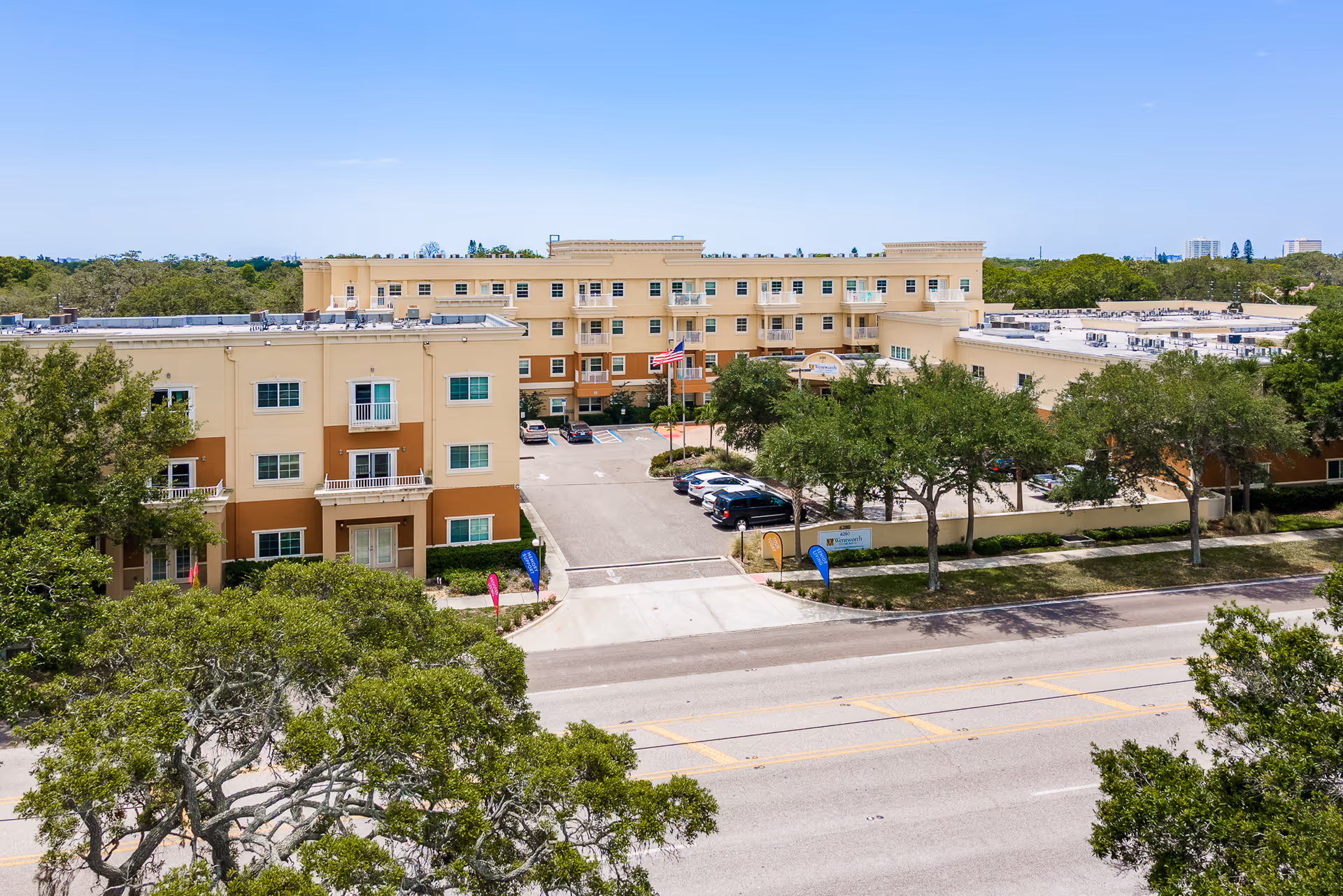 Aerial view of Wentworth Central Avenue senior living campus with parking and trees.