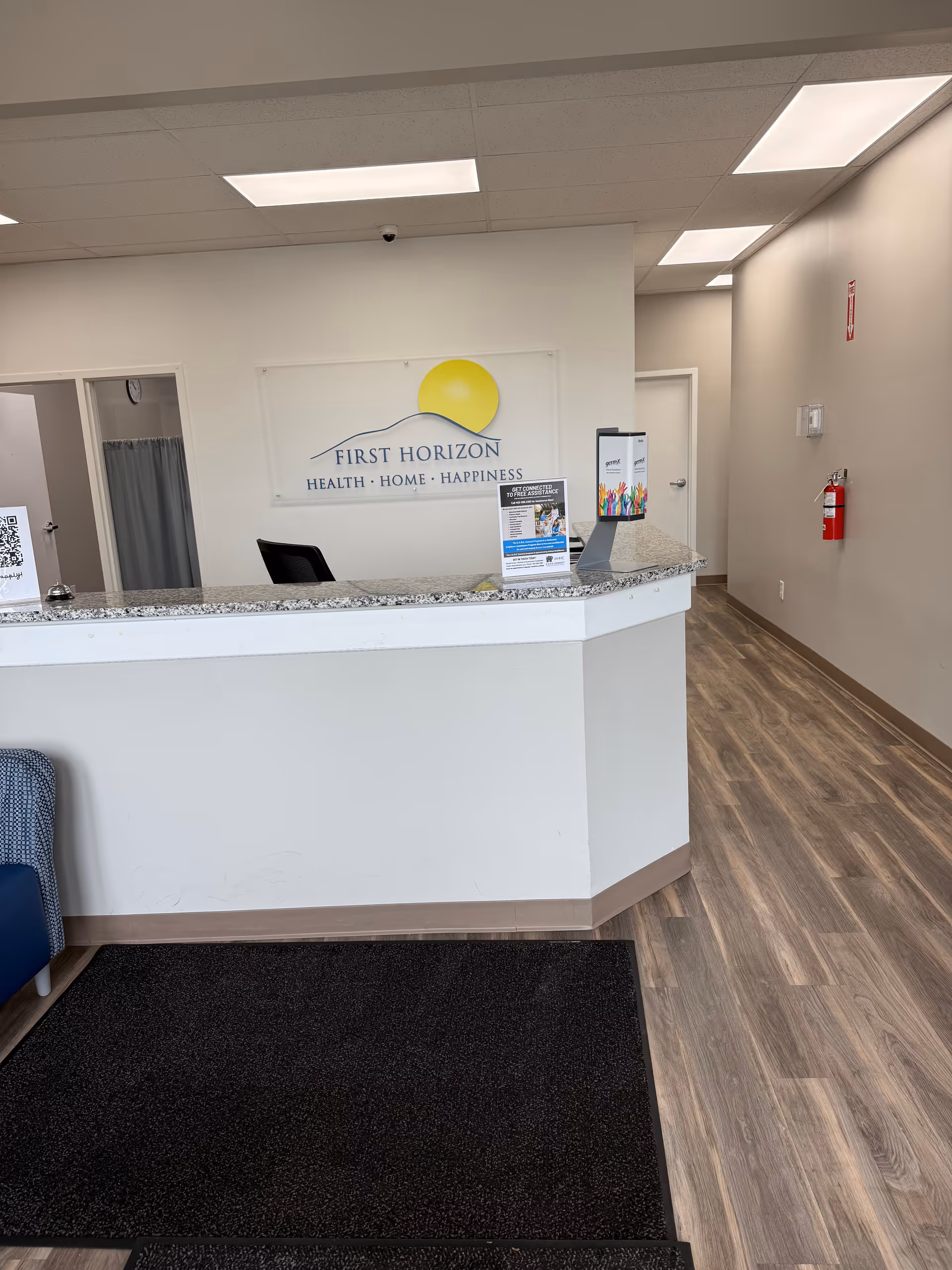 Reception desk inside the facility with a First Horizon sign on the wall.