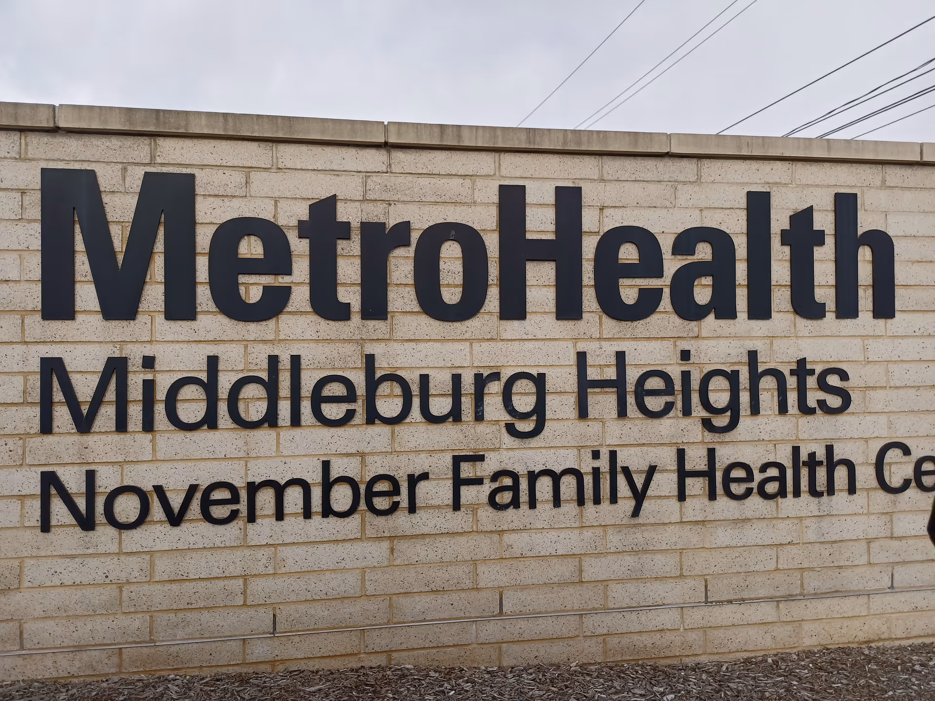 Brick wall with large MetroHealth sign reading November Family Health Center.