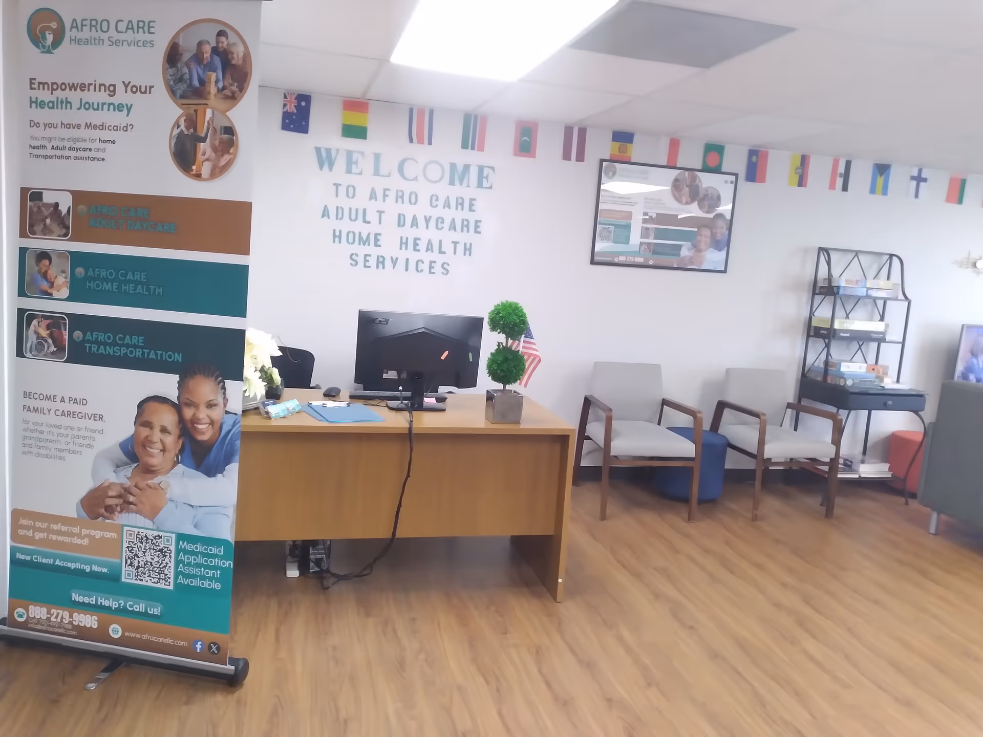 Reception area with a desk, chairs, and a welcome sign inside Afro Care Health Services.
