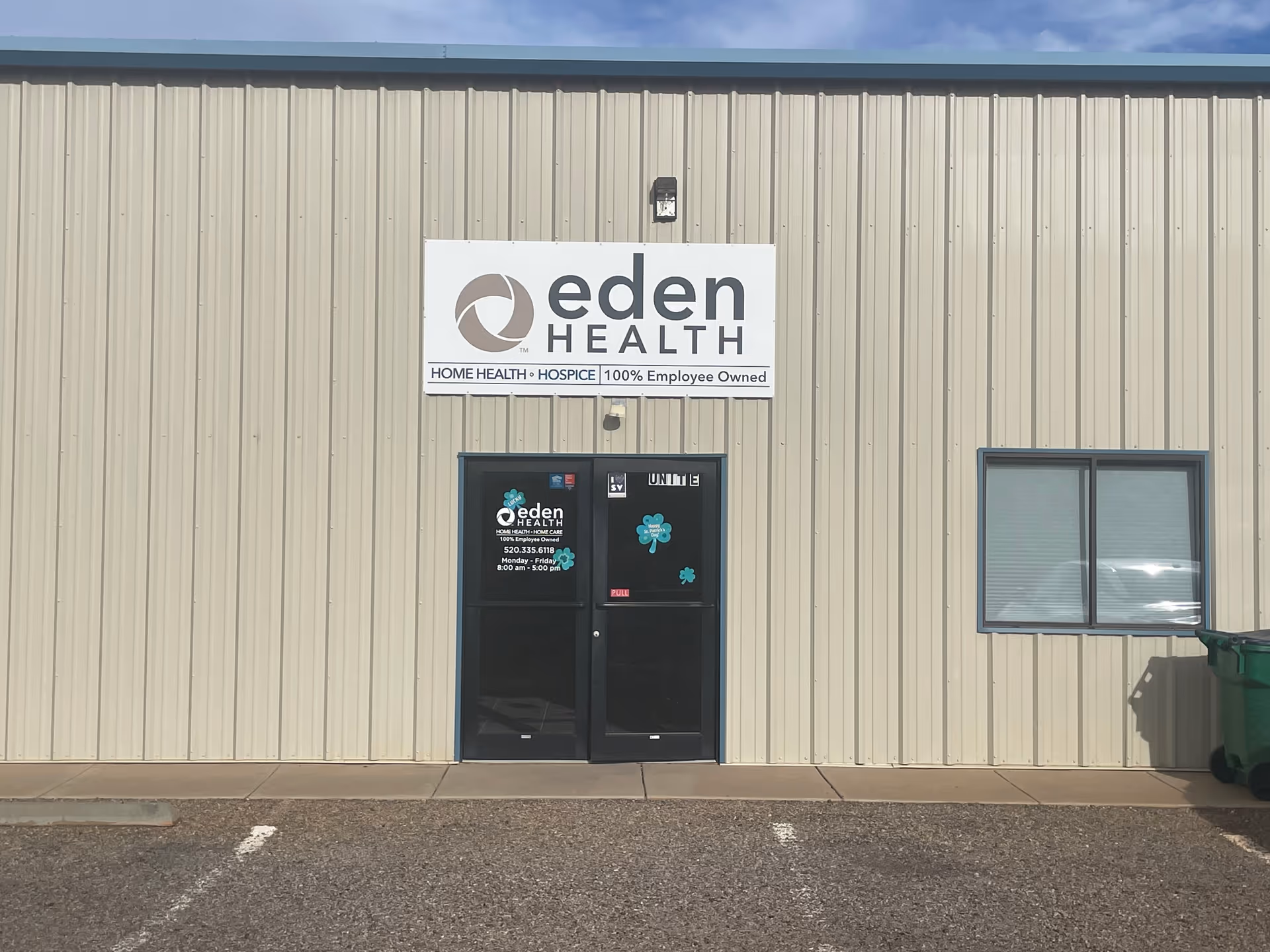 Exterior view of Eden Health building with a sign, glass doors, and a window.