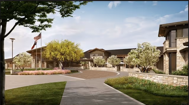 Exterior view of Avanti Senior Living at Augusta Pines with landscaped courtyard and entrance.