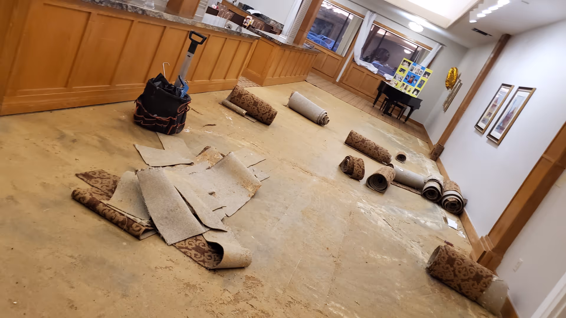 Beacon Home Care at Cogir of Fremont interior hallway with rolled carpets and debris.