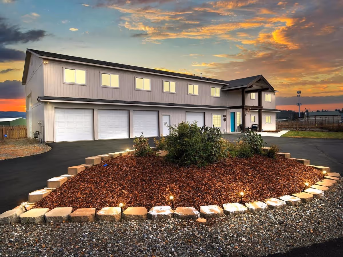 Exterior view of Fahari 2 Adult Family Home LLC building with driveway and mulch bed