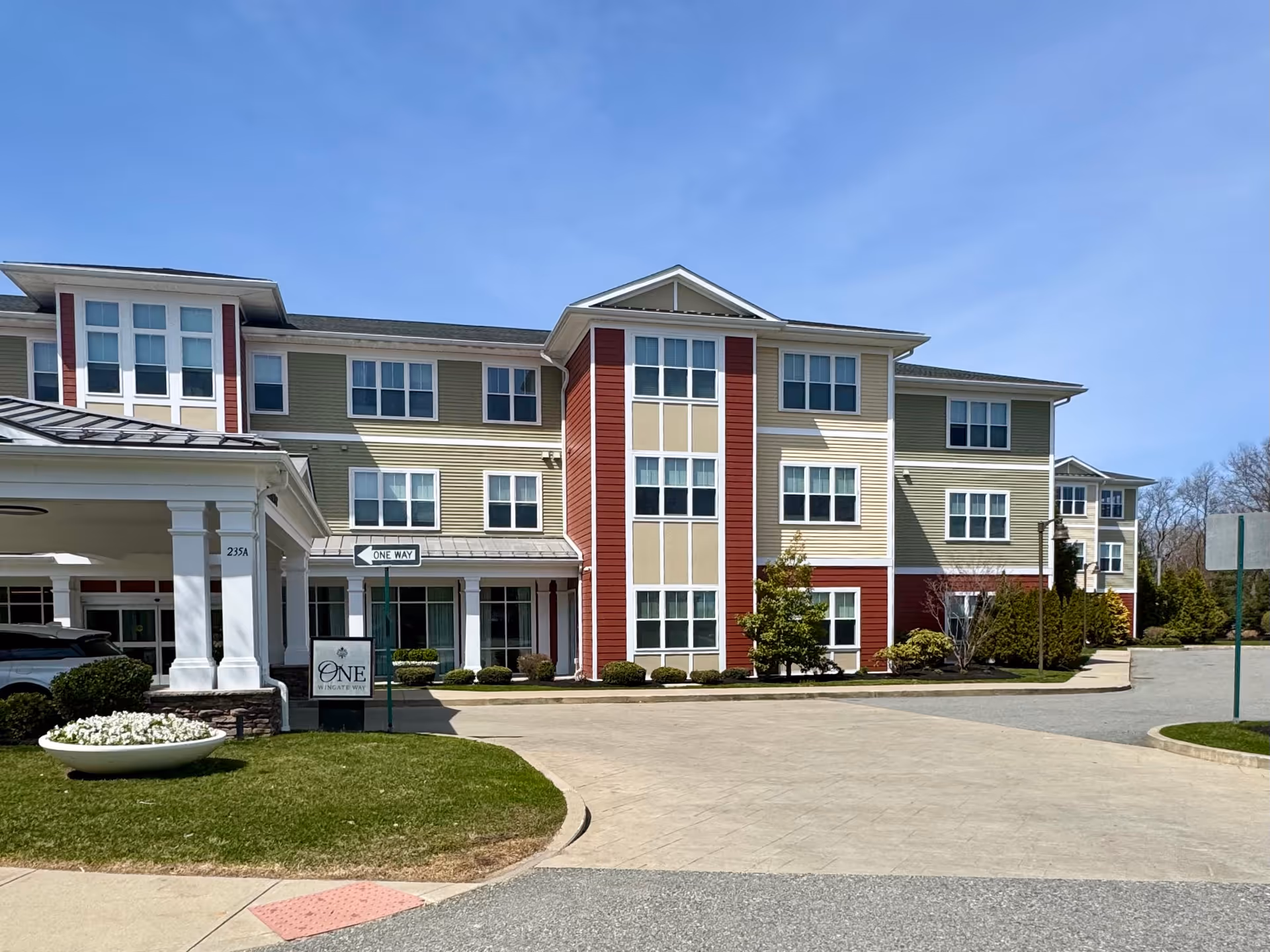 Exterior view of Wingate Residences at Needham, a multi-story senior living building.