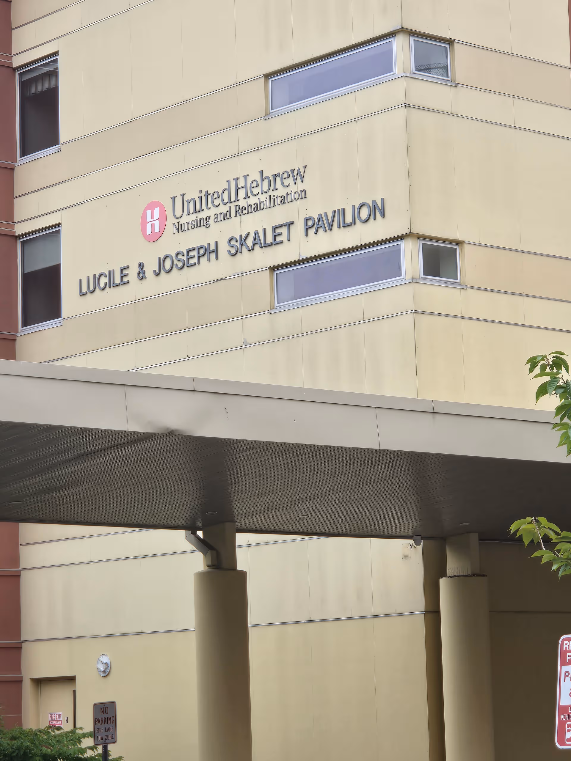 Exterior of a beige building with United Hebrew Nursing and Rehabilitation signage and Skalet Pavilion.