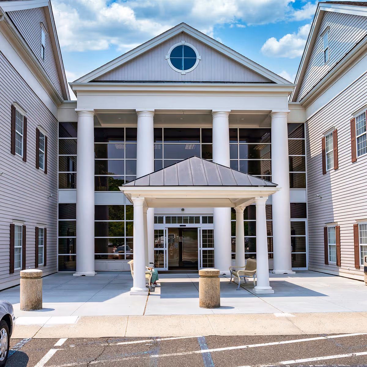 Front view of Nuvance Health Medical Practice entrance with tall white columns.