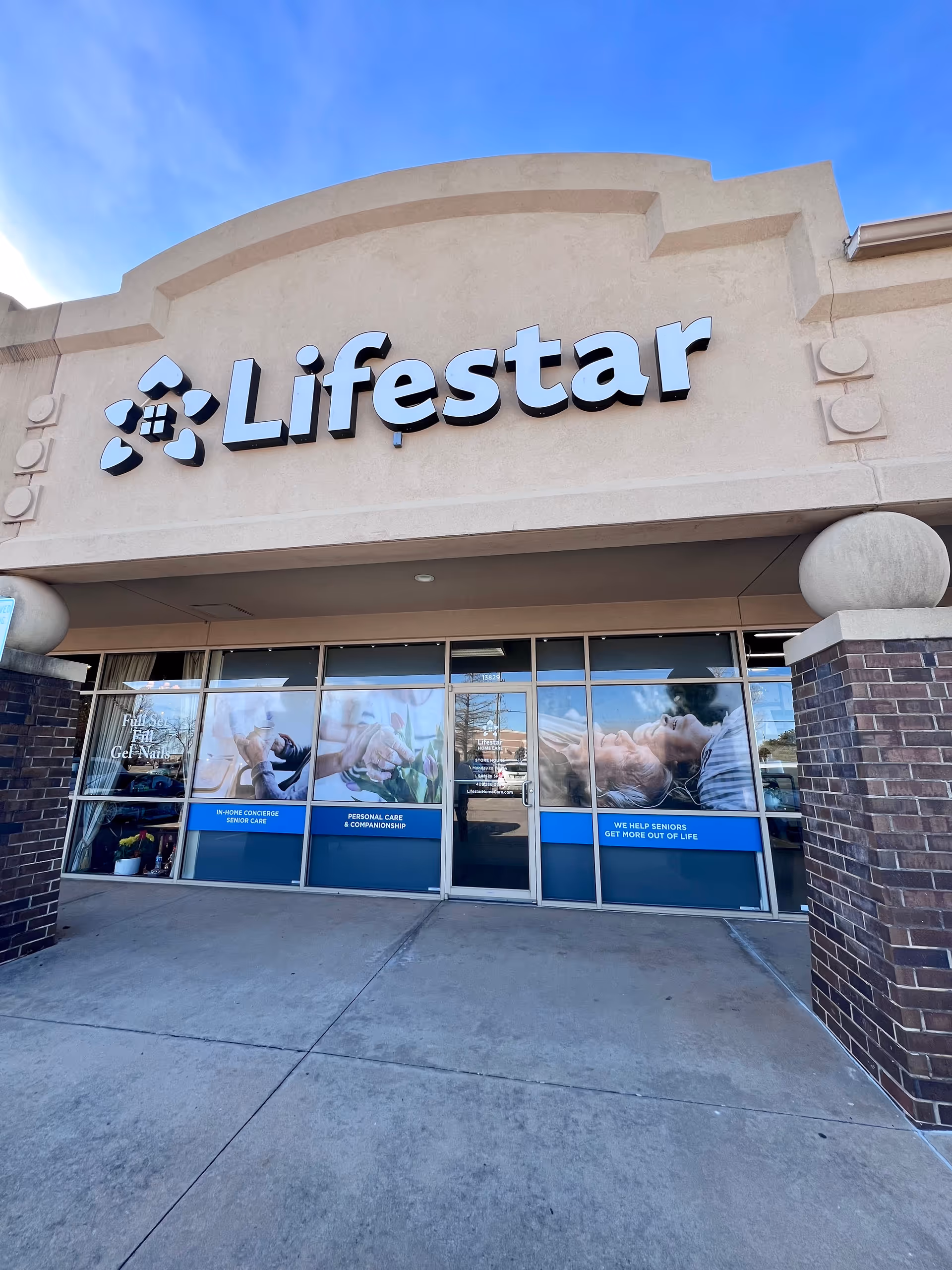Exterior of Lifestar Home Care building with large sign and glass doors.