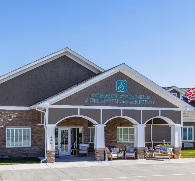 Front view of Edencrest at Siena Hills entrance with a covered porch and seating.