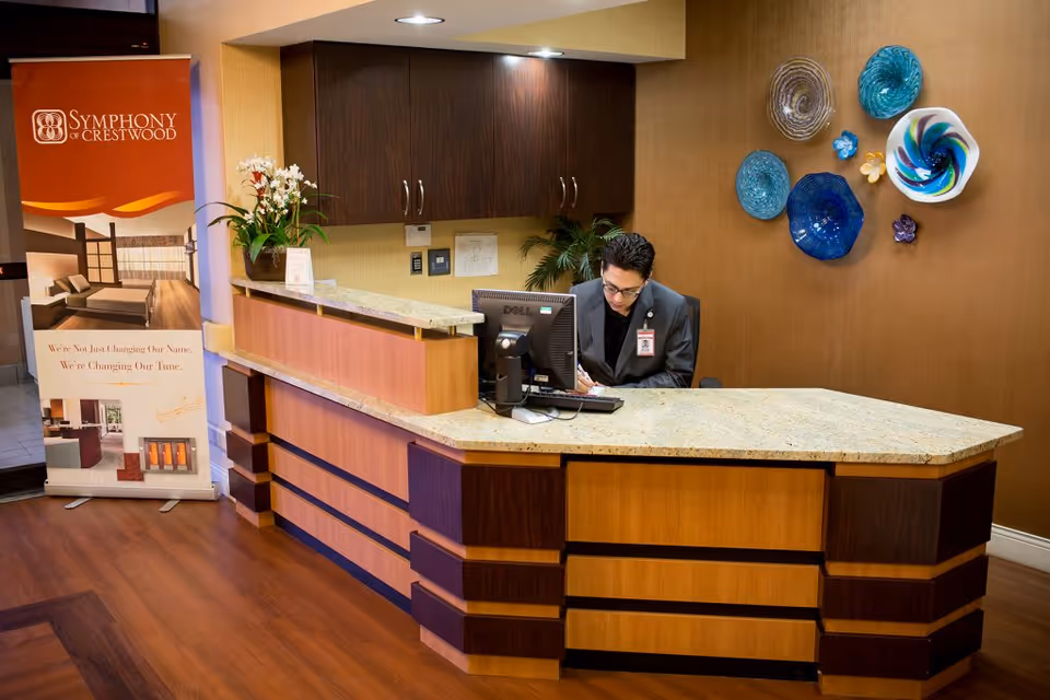 Reception area at Crestwood Rehabilitation Center with a staff member at the desk.