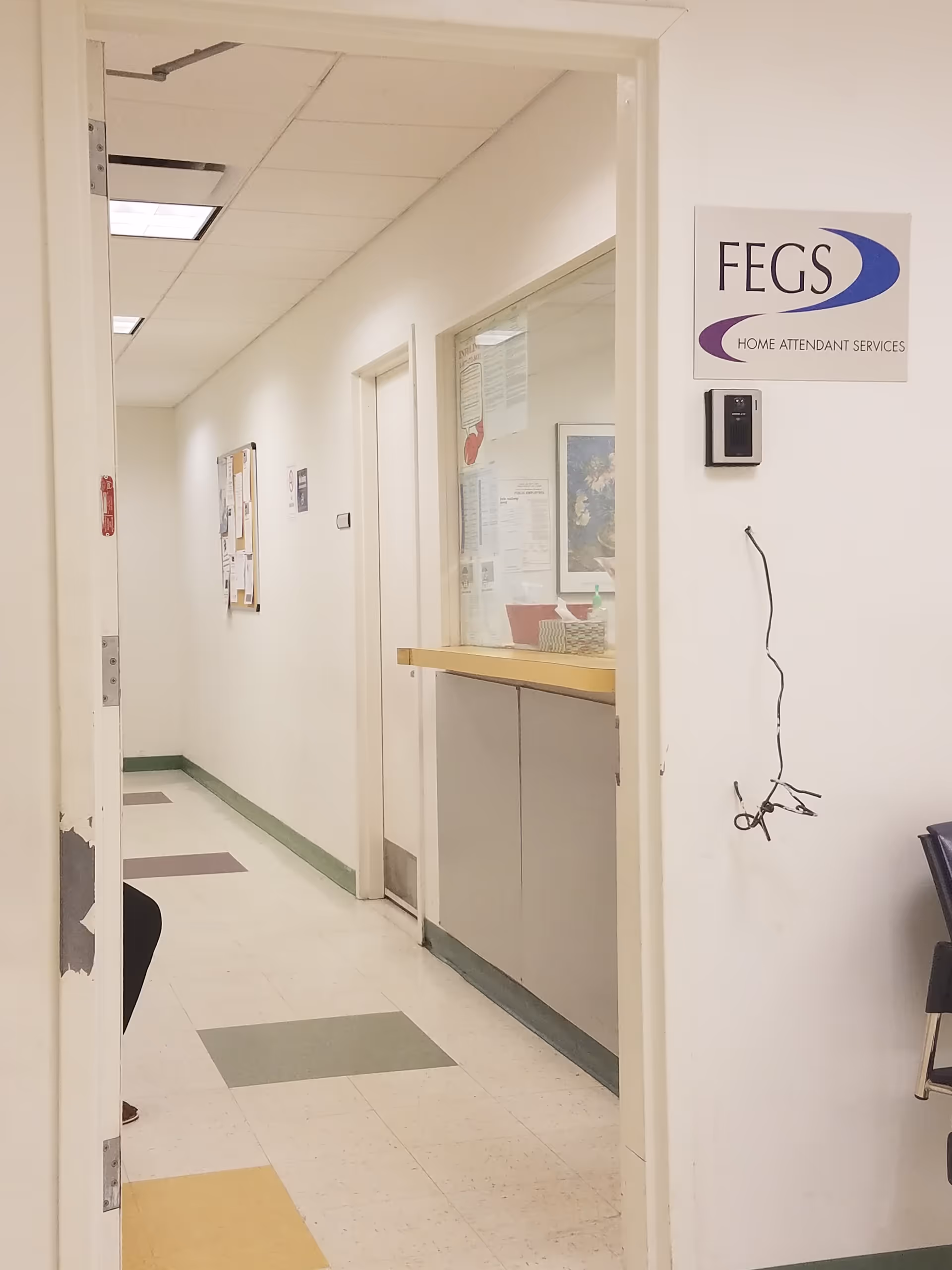 Interior hallway of FEGS Home Attendant Services with a counter and doorway