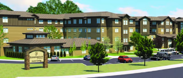 Exterior view of Bonaventure of Vancouver senior living building with parking and sign.