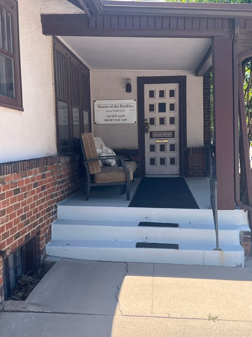 Front entrance of Hearts of the Rockies Home Health Care LLC with porch seating.