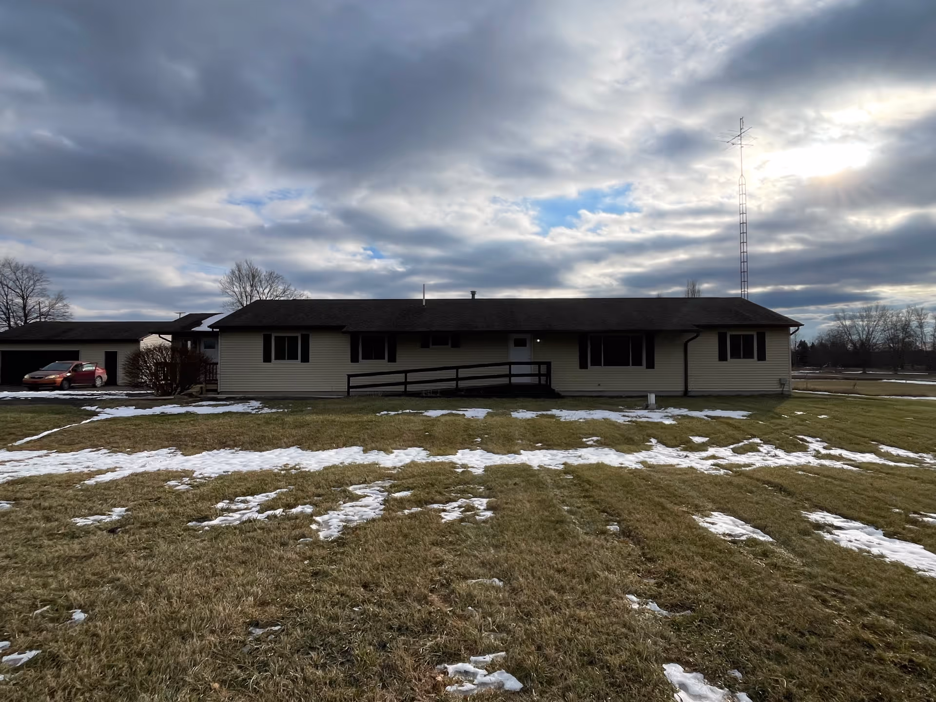 Front view of a single-story Brookhaven AFC Home building on a snowy lawn.