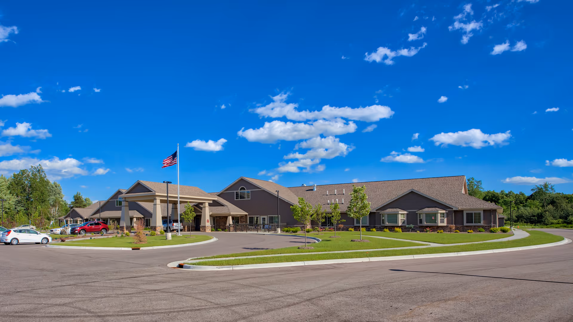 Exterior view of Charter Senior Living of Davison with front entrance and parking