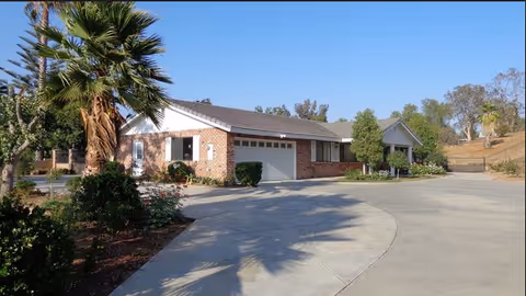 Exterior view of Citiview Residential Care building with curved driveway and landscaped front.