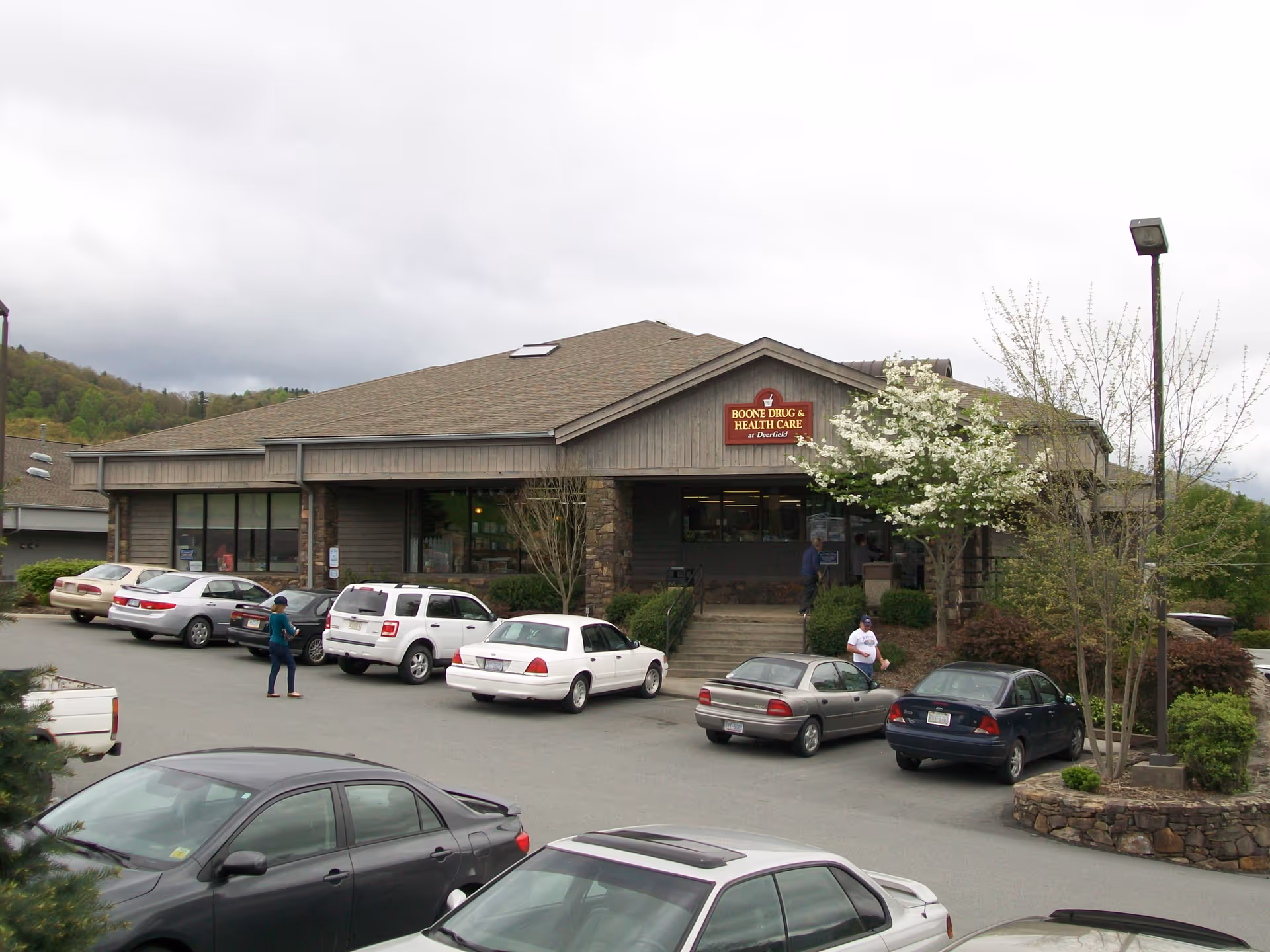 Exterior view of Boone Drug & Health Care at Deerfield with parked cars.