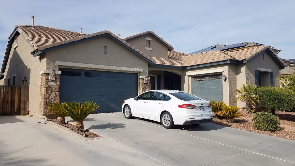 Golden Tree Care Home exterior: a white car parked in the driveway of a home.